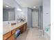 Bright bathroom featuring double sinks, a large mirror, and ample counter space for convenient morning routines at 15144 Dry Creek Rd, Noblesville, IN 46060