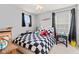 Cozy bedroom features a black and white checkered bedspread at 15144 Dry Creek Rd, Noblesville, IN 46060