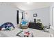 Charming bedroom with starry decor, comfortable bed, and cozy armchair creating a playful space at 15144 Dry Creek Rd, Noblesville, IN 46060