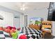 Bright bedroom features a black and white checkered bedspread at 15144 Dry Creek Rd, Noblesville, IN 46060