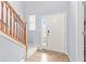 Home foyer featuring tile flooring, staircase, and bright natural light at 15144 Dry Creek Rd, Noblesville, IN 46060