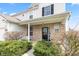 Inviting front porch with stone accents and a well-kept garden at 15144 Dry Creek Rd, Noblesville, IN 46060