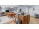 Open-concept home showcasing kitchen island, stainless steel appliances, and view into dining area at 15144 Dry Creek Rd, Noblesville, IN 46060