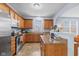 Spacious kitchen features wood cabinets, stainless steel appliances and large countertop space at 15144 Dry Creek Rd, Noblesville, IN 46060