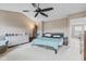 Spacious main bedroom featuring a ceiling fan, comfortable bed, and ample natural light for a relaxing atmosphere at 15144 Dry Creek Rd, Noblesville, IN 46060
