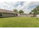 Expansive backyard with a wooden fence, offering privacy and plenty of space for recreation at 1579 Winding Creek Trl, Brownsburg, IN 46112