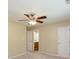 This bedroom features neutral paint, a ceiling fan, and an attached bathroom at 1579 Winding Creek Trl, Brownsburg, IN 46112