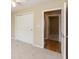 This bedroom features carpet, neutral paint, a ceiling fan, and closet with sliding doors at 1579 Winding Creek Trl, Brownsburg, IN 46112