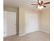This carpeted bedroom has a ceiling fan, closet with sliding doors, and a closet door at 1579 Winding Creek Trl, Brownsburg, IN 46112