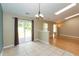 Open concept dining area with tile floors, skylights, and sliding door access to the outdoor patio space at 1579 Winding Creek Trl, Brownsburg, IN 46112