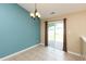 Eat-in kitchen/dining room has ceramic tile and a sliding glass door leading to the wooden deck at 1579 Winding Creek Trl, Brownsburg, IN 46112
