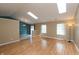 Bright living room featuring wood floors, neutral walls, recessed lighting, and skylights for natural light at 1579 Winding Creek Trl, Brownsburg, IN 46112