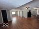 Spacious living room features sleek hardwood flooring and ample natural light at 1619 E 20Th St, Muncie, IN 47302
