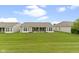 Backyard view featuring a well-manicured lawn and patio, perfect for enjoying the outdoors at 16243 Oliver St, Fishers, IN 46037