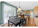 View of the eat-in dining area with access to the patio and view into the kitchen at 16243 Oliver St, Fishers, IN 46037