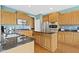 Bright kitchen features an island with dark granite countertop and stainless steel appliances at 16243 Oliver St, Fishers, IN 46037