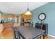 Eat-in kitchen with stainless appliances and adjacent dining area with bar at 16243 Oliver St, Fishers, IN 46037
