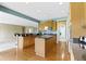 Spacious kitchen features wood cabinets, granite counters, an island, and stainless steel appliances at 16243 Oliver St, Fishers, IN 46037