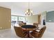 Open living space features poker table, bar seating, and comfortable seating area at 16243 Oliver St, Fishers, IN 46037