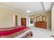 This expansive main bedroom has multiple entryways, neutral paint, and carpeted floors at 16243 Oliver St, Fishers, IN 46037