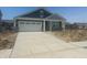 Charming single-story home with a covered front porch, attached garage, and concrete driveway at 1644 Winn Ct, Fortville, IN 46040