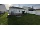 Backyard with a spacious deck, a well-maintained lawn, and convenient shed storage at 1833 Southernwood Ln, Indianapolis, IN 46231