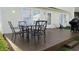 Backyard deck with outdoor seating, perfect for enjoying the outdoors and grilling at 1833 Southernwood Ln, Indianapolis, IN 46231