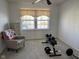 Bright room with neutral carpet, a ceiling fan, and weightlifting equipment creating a functional space at 1833 Southernwood Ln, Indianapolis, IN 46231