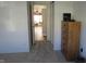 Bedroom doorway view leading into a living area with hardwood flooring at 1833 Southernwood Ln, Indianapolis, IN 46231