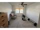 Spacious room featuring neutral carpet, a ceiling fan, and weightlifting equipment at 1833 Southernwood Ln, Indianapolis, IN 46231