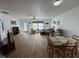 Spacious living room with a ceiling fan, furniture set, dining area, and TV console at 1833 Southernwood Ln, Indianapolis, IN 46231