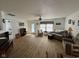 Inviting living room with wood flooring, neutral tones, and a ceiling fan at 1833 Southernwood Ln, Indianapolis, IN 46231