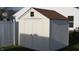 Durable backyard shed with double doors and a small window for secure storage at 1833 Southernwood Ln, Indianapolis, IN 46231