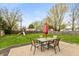 Fenced backyard with a patio and outdoor seating area, ideal for entertaining guests at 204 S Hougland St, Trafalgar, IN 46181