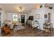 Bright living room with hardwood floors and tasteful decor at 204 S Hougland St, Trafalgar, IN 46181