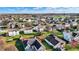 The aerial shot showcases a community with single-Gathering homes and well-maintained lawns at 209 Allen Ln, New Whiteland, IN 46184