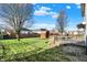 Backyard featuring green grass, a storage shed, and a wooden deck at 209 Allen Ln, New Whiteland, IN 46184