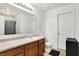 Bathroom featuring a single sink vanity, mirror, and toilet at 209 Allen Ln, New Whiteland, IN 46184