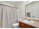 Bathroom features a single sink vanity, toilet, shower with white curtain and silver accents at 209 Allen Ln, New Whiteland, IN 46184