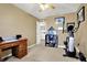 Bedroom with desk area, decorative shelving, and exercise equipment at 209 Allen Ln, New Whiteland, IN 46184