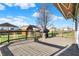 A wooden deck with dark wood railing and an awning provides the perfect outdoor BBQ space at 209 Allen Ln, New Whiteland, IN 46184