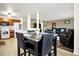 Open-concept kitchen and dining area with modern furnishings and an inviting atmosphere at 209 Allen Ln, New Whiteland, IN 46184