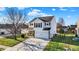 Well-maintained two-story home with lush greenery and a spacious driveway at 209 Allen Ln, New Whiteland, IN 46184