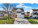 Inviting two-story home with a well-kept lawn and a convenient two-car garage at 209 Allen Ln, New Whiteland, IN 46184