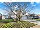 Charming two-story home features a two-car garage and well-manicured front lawn at 209 Allen Ln, New Whiteland, IN 46184