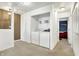 Laundry Room features washer and dryer with storage, and a glimpse into the bedroom at 209 Allen Ln, New Whiteland, IN 46184