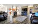 Spacious living room with hardwood floors, fireplace, and open layout to the kitchen and entry at 209 Allen Ln, New Whiteland, IN 46184