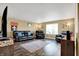 Comfortable living room with dark wood floors and ample seating for Gathering and guests at 209 Allen Ln, New Whiteland, IN 46184