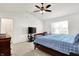 Large main bedroom offering carpet floors, window for natural light, and ceiling fan at 209 Allen Ln, New Whiteland, IN 46184