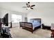 Spacious main bedroom boasting natural light, carpeting, and ample room for a seating area at 209 Allen Ln, New Whiteland, IN 46184